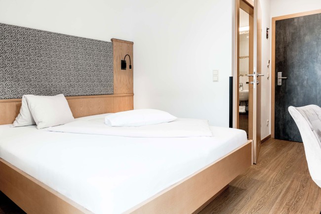 Queensize Bett im Hotel die Barbara